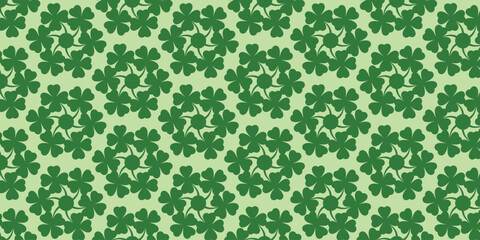 Dark green clover leaf motif pattern on a light green background