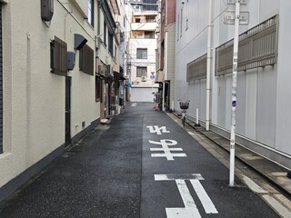 Naklejka premium Osaka, Namba, Doton,Japan, Authentic Japanese Alleyway with Shops and Urban Architecture – Empty Street with Traditional Buildings in Japan