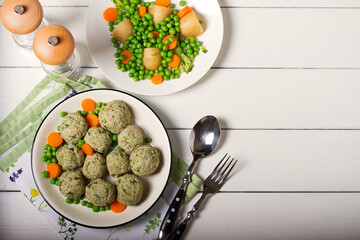 Turkey and spinach meatballs with vegetables. View from above, flat layout