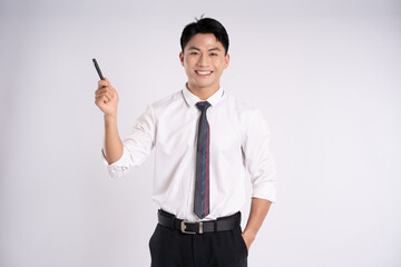 Portrait of young Asian business man posing on white background