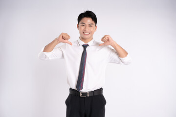 Portrait of young Asian business man posing on white background