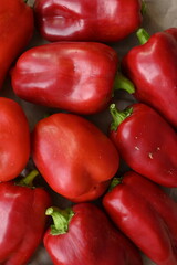 texture of red bell peppers as a background, autumn ripe juicy red bell peppers as a background, juicy organic food