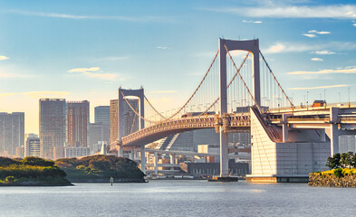 Rainbow bridge in Odaiba, Tokyo, Japan. Rainbow bridge at sunset landscape.