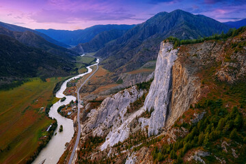 Naklejka premium Sunset landscape Altai mountains white rock with green forest and winding river, aerial top view