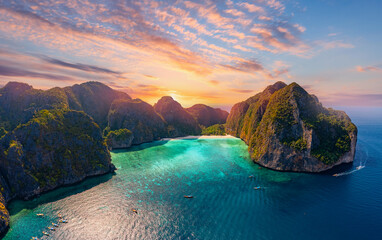 Lagoon Maya Bay , island Ko Phi Phi Leh, Thailand, aerial top view sunset. Amazing drone travel photo of turquoise water and white beach