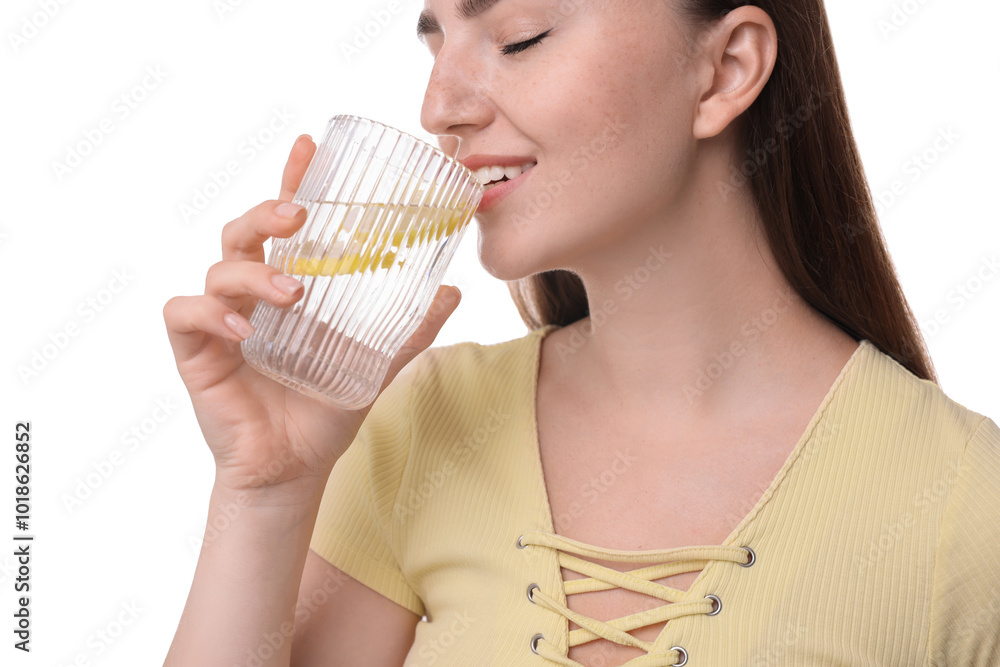 Wall mural Woman drinking water with lemon on white background, closeup