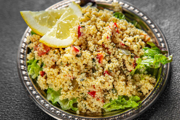 tabbouleh dish bulgur couscous vegetables fresh vegetarian and vegan food gourmet food background on the table rustic food top view copy space
