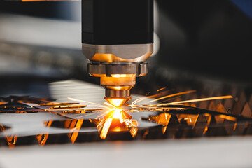 Laser CNC cut of metal with light spark. Industry background banner, modern technology industrial.