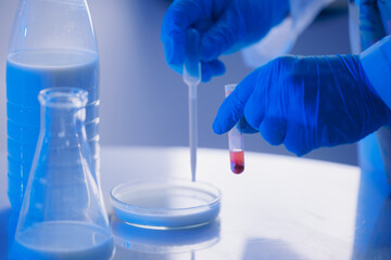 Fototapeta premium Quality control test of milk in laboratory. Dairy factory industry products