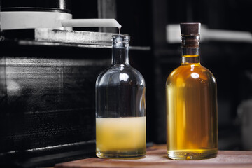 Bottling of oil from hydraulic press for production of extra virgin sunflower seed, eco healthy food manufacturing