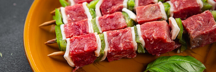 kebab raw meat fresh vegetables pork, lard, pepper, vegetable dish gourmet food background on the table rustic food top view copy space