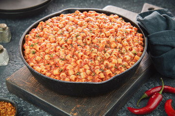 Arabic Cuisine; spicy pasta ''Mbakbaka'' is common in Egyptian and Libyan culture. It's delicious pasta stew with rich and spicy tomato sauce. Garnish with fresh thyme.