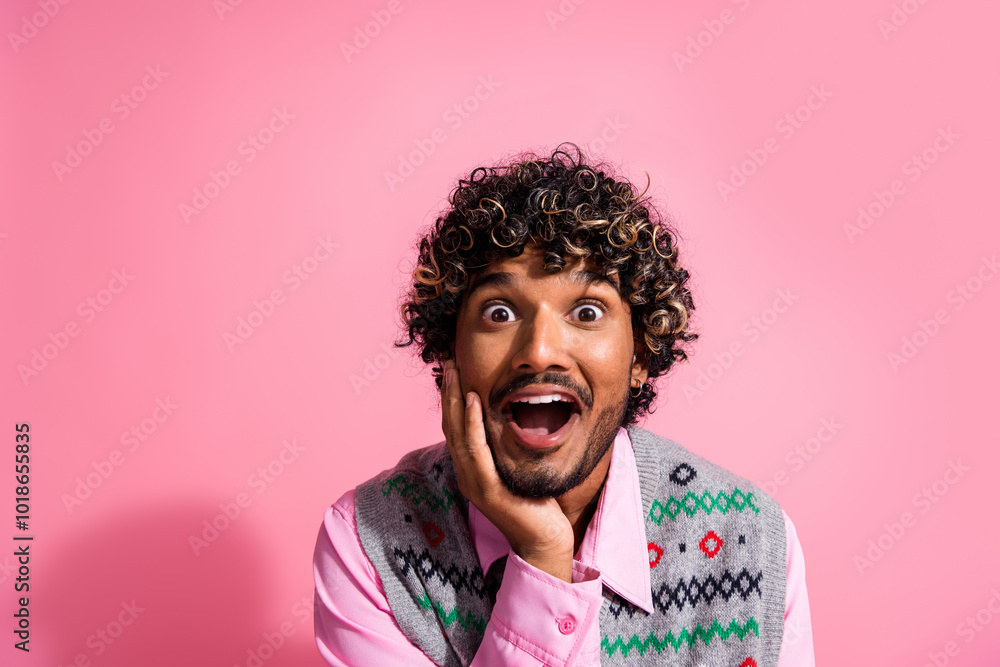 Wall mural Photo of excited good mood guy wear print vest celebrating noel xmas emtpy space isolated pink color background