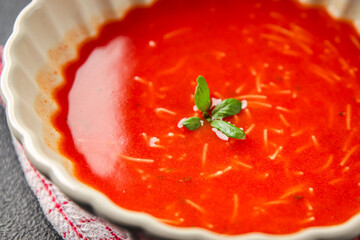 Tomato soup vermicelli gazpacho first course dish fresh gourmet food background on the table rustic food top view copy space