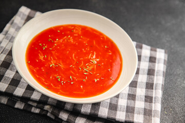 Tomato soup vermicelli gazpacho first course dish fresh gourmet food background on the table rustic food top view copy space