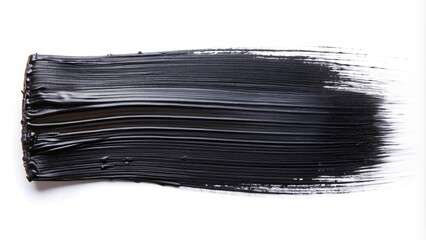 Black brush stroke of acrylic or oil paint on a white background medium shot