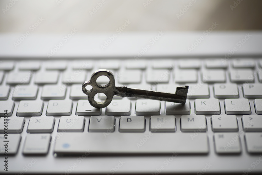 Aufkleber antique key on modern keyboard: symbolizing digital security and encryption