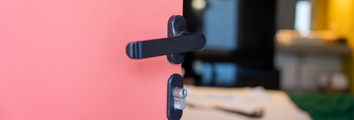 hotel room door half open, orange and yellow design, service industry concept