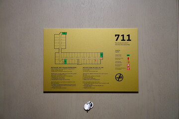 Hotel room evacuation plan on wall