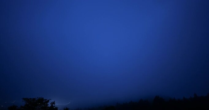View of Gotemba city and the crescent moon from the foggy Hakone mountains in Japan. 4K,H.264,422,10bit.