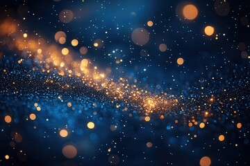 magical winter night scene twinkling gold holiday lights and sparkling dust particles creating a bokeh effect against a deep rich blueblack background