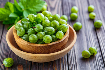 Green Organic Berries Gooseberries.Green gooseberries in a wooden bowl.Gooseberries on the wooden table. Harvest concept. Vegetarian food.