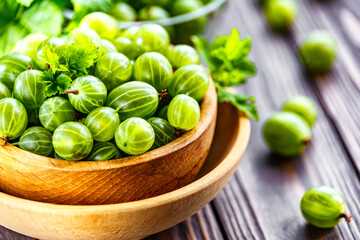 Green Organic Berries Gooseberries.Green gooseberries in a wooden bowl.Gooseberries on the wooden table. Harvest concept. Vegetarian food.