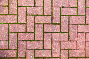 Texture of masonry stones with an uneven surface on the ground