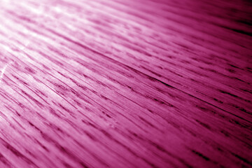 Fototapeta premium Oak wood texture with blur effect close up covered with pink stain