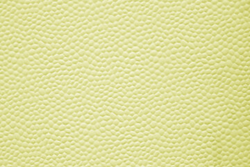 Aluminum bubbled metal sheet texture painted in yellow color.