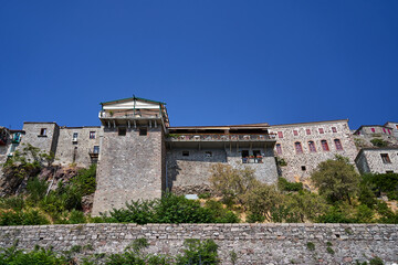 Fototapeta premium Historic houses with balconies on a rocky hillside in Molyvos on the island of Lesbos