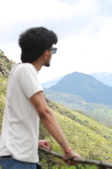 Naklejka premium person on the top of a mountain