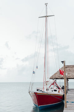 Red sailboat on the water