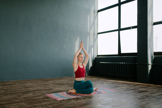 Woman Meditating At Studio