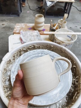 Unfinished and unglazed pottery mug