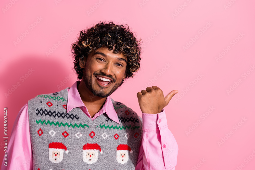 Canvas Prints Photo of nice young man direct finger empty space wear christmas vest isolated on pink color background