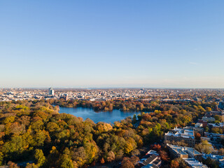 Aerial landscape of Prospect Park lake and Brooklyn Manhattan Skyline during fall in New York City