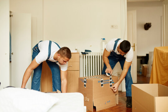 Workers assemble the boxes