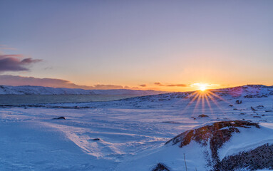 Bright dawn on the coast of the Barents Sea in the village of Teriberka in the Murmansk region of Russia.