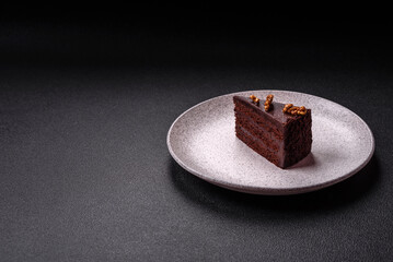 Piece of sweet chocolate cake with nuts