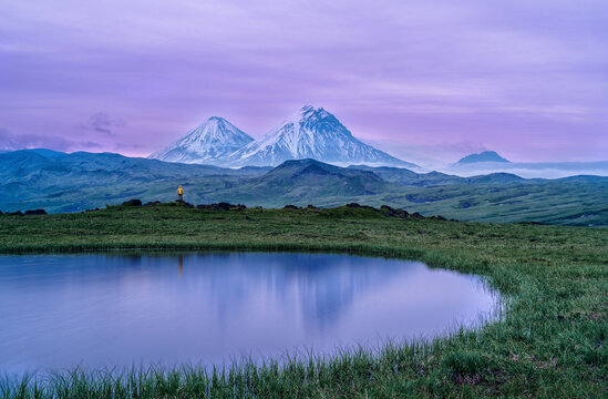 View the Klyuchevskaya Sopka and Nameless Gorely volcanoes on the Kamchatka Peninsula in Russia.