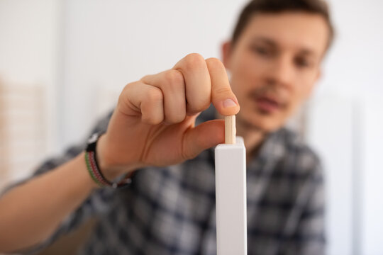 Man assembling modern furniture 