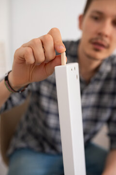 Man fastening dowel