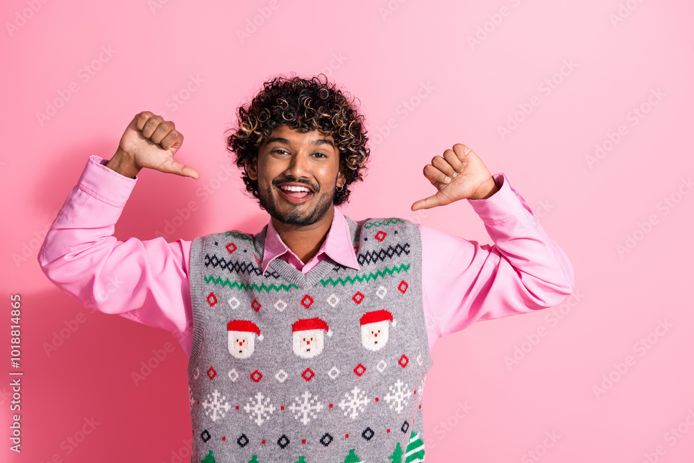 Wall mural Photo of nice young man point fingers himself self wear christmas vest isolated on pink color background