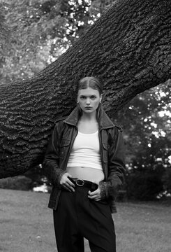 Artistic photo of a model posing in park