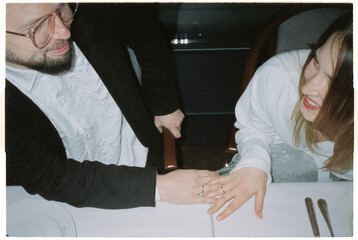 Newlywed joyful bride groom with hands clasping together