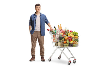 Guy with a shopping cart full of groceries