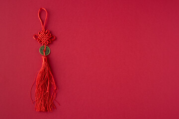 Lucky and prosperity amulet on red background.