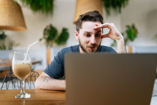 Working on Laptop in Cafe
