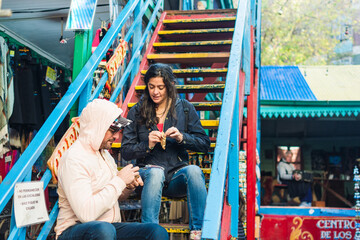 Tourists eating alfajor in Buenos Aires